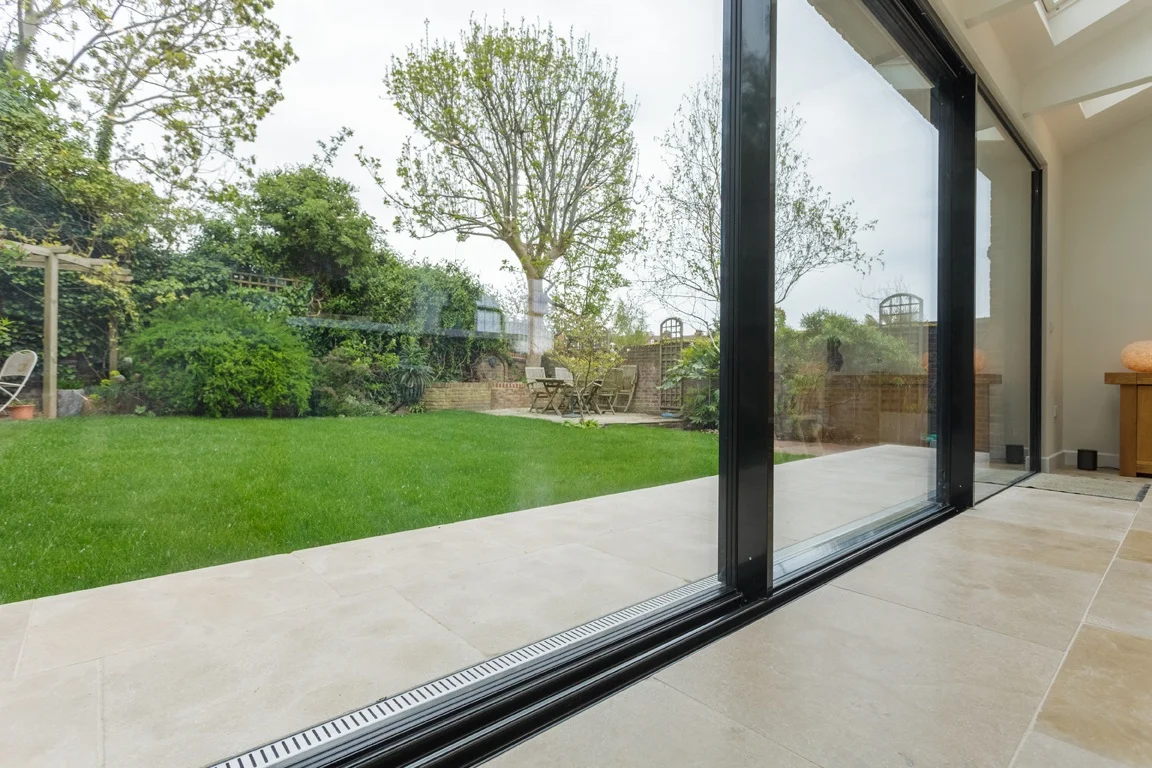 seams connection from interior to exterior as flooring extends through doors