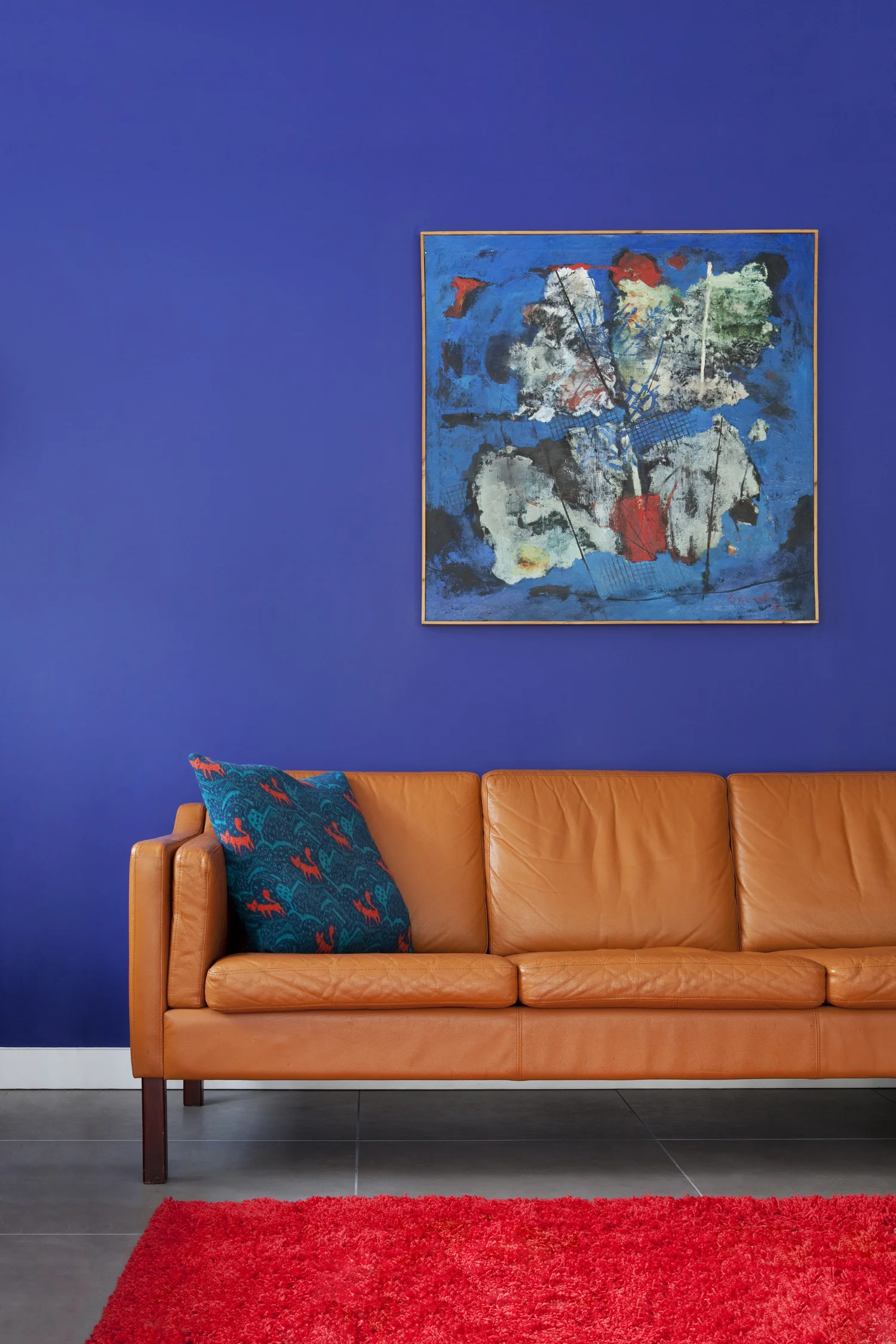orange leather sofa purple wall