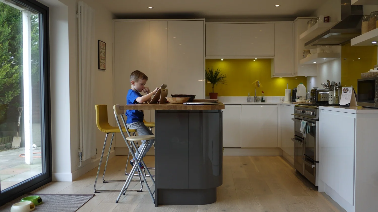 boy at island in modern family kitchen