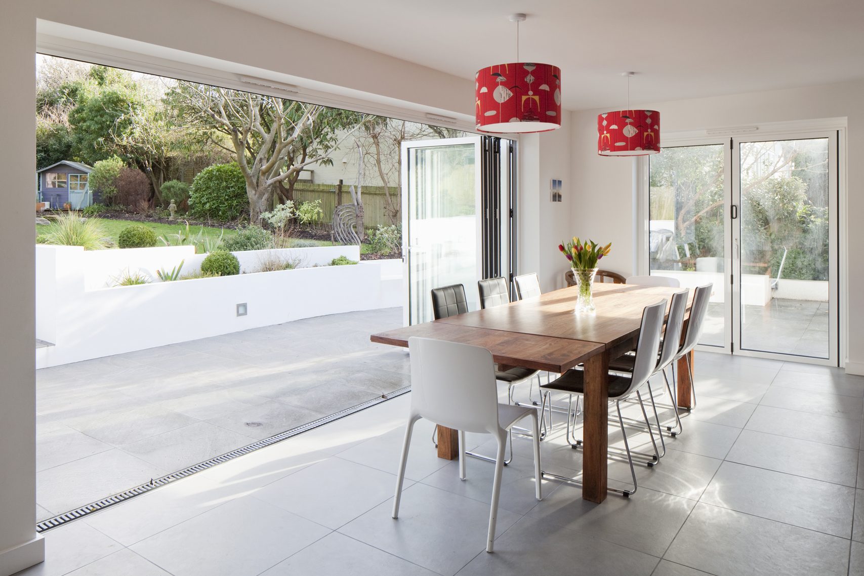 dining room with lots of light sliding doors open