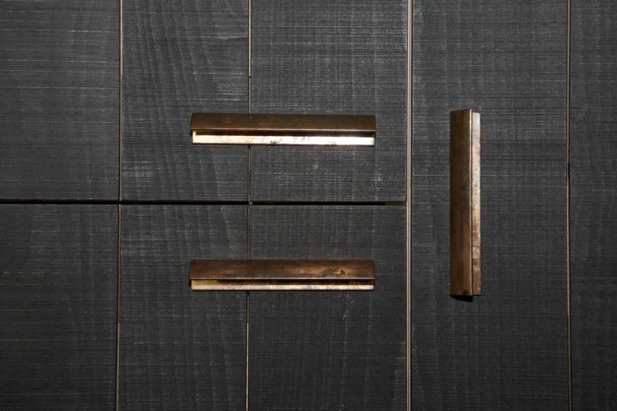 dark wood with copper recessed finger pulls