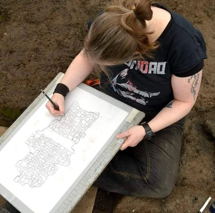 Drawing the remains of a Bronze Age wheel at Must Farm, Cambridge Archaeological Unit