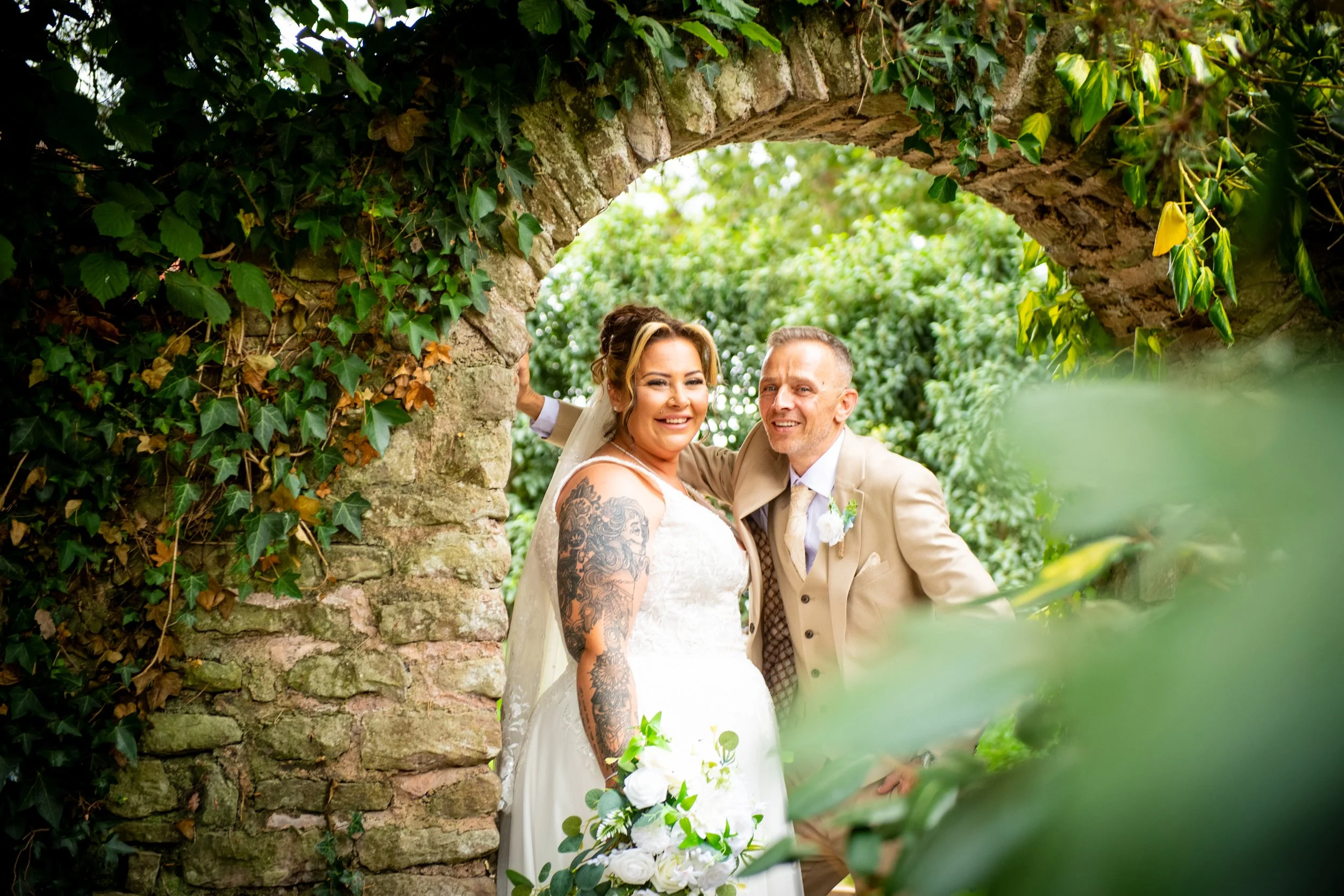 Romantic candid portrait of a newly married couple on the grounds of Cefn Tilla Court captured by Emotion Picture Photography
