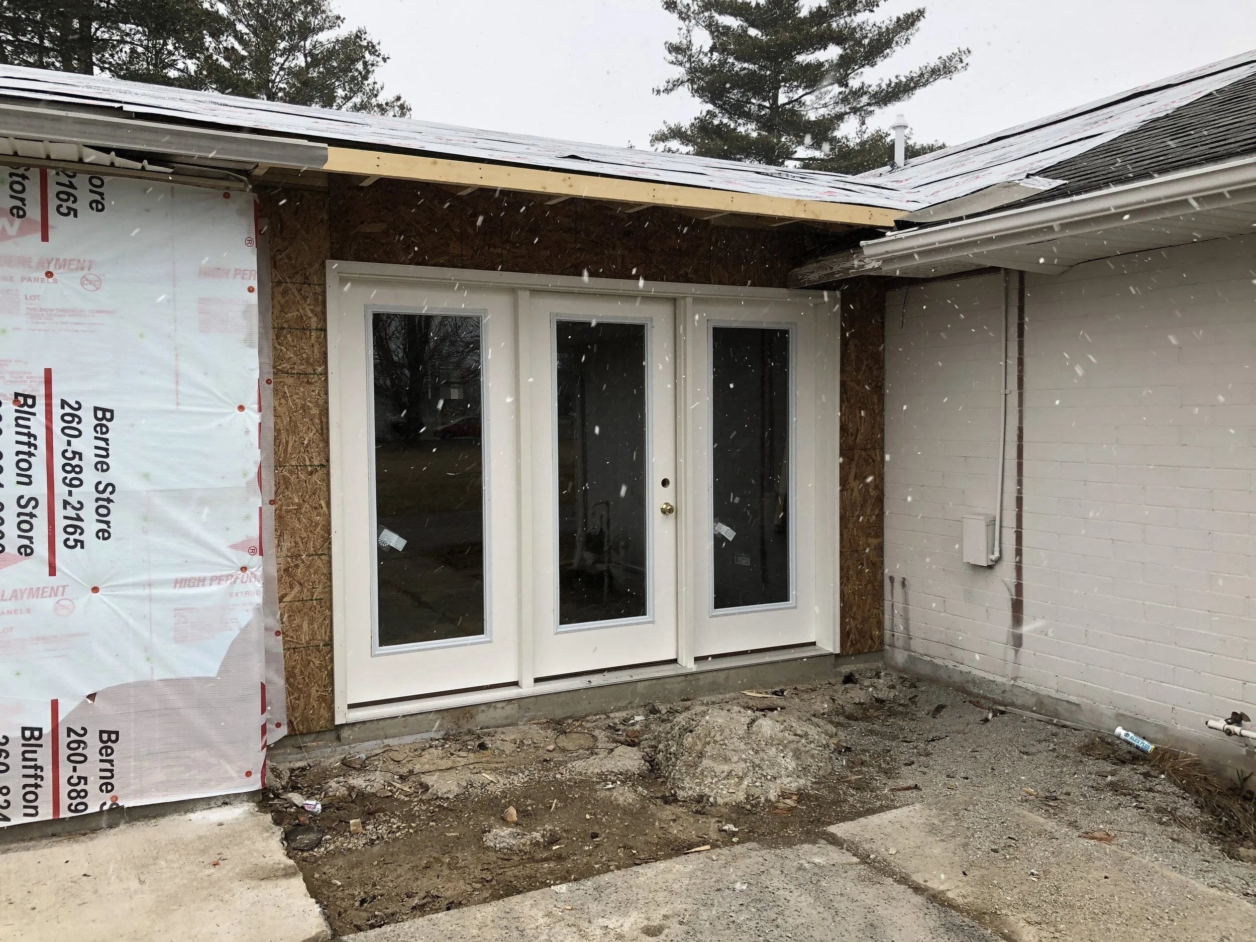 so the old patio turned into this enclosed area with window doors.