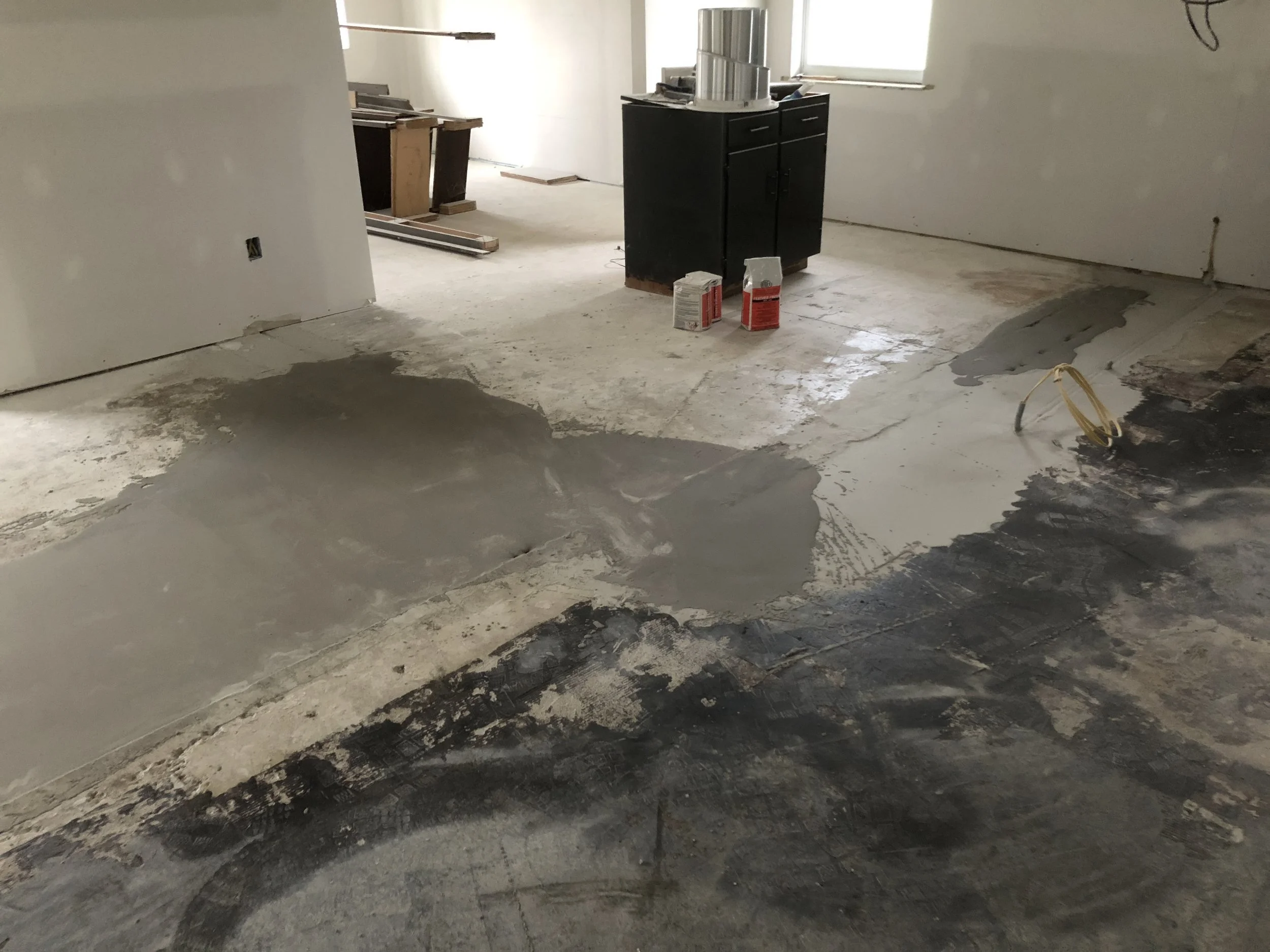 So much self leveler had to happen to get it looking like this! He even was able to trench in an electric line so I could get electric in my island! He also had to grind out some high bits which is a painstaking task.