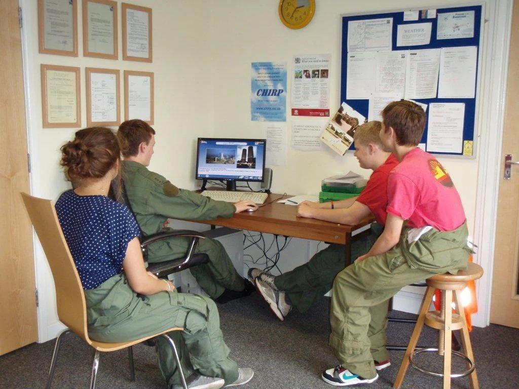 Airport scholarship students using the club computer to learn more about Air Law.
