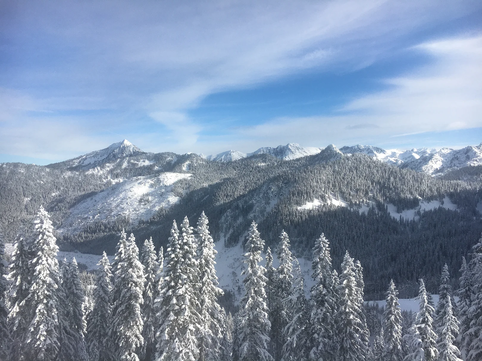 Stevens Pass ridgeline on a Pacific Northwest snowboarding trip one early morning after Avalanche Control finished clearing the way.