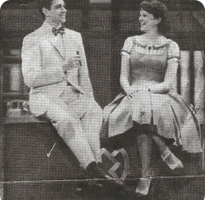 Shauna Hicks and Ralph Macchio star in How to Succeed in Business...