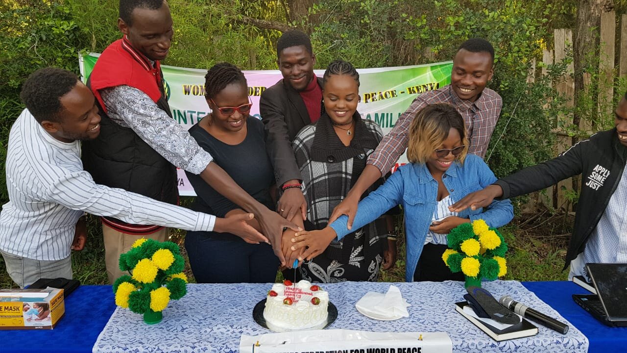 Young couples cutting the cake - wfwp kenya.jpg