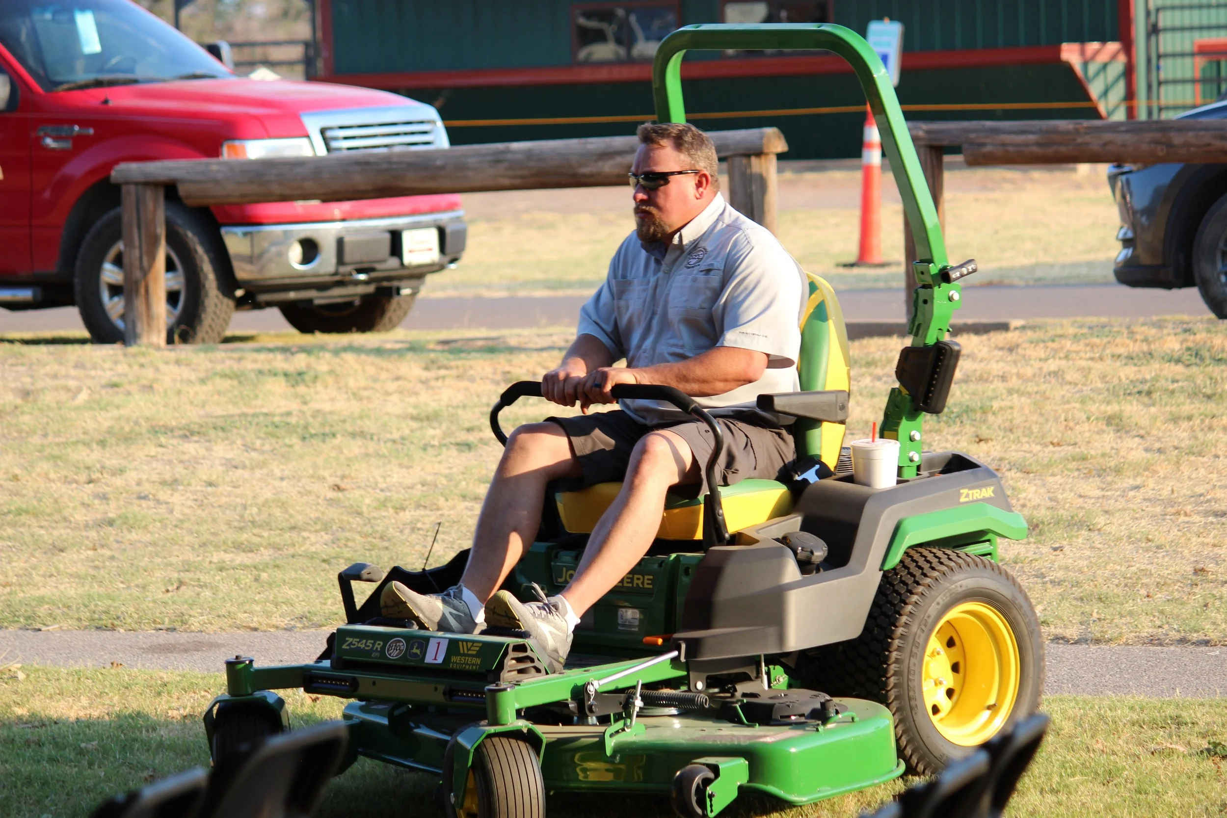 Chris driving mower.JPG