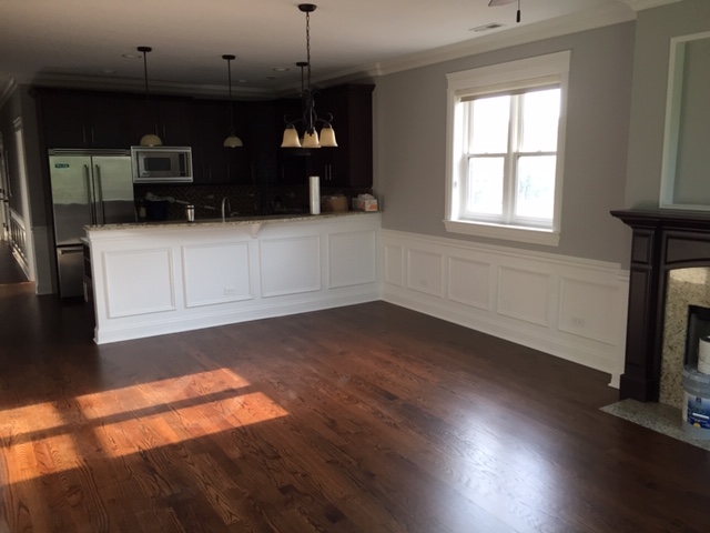 After the owners moved out of their condo they wanted to spruce up the place by refinishing the floors, repainting the walls and wainscoting as well as replacing a leaking window