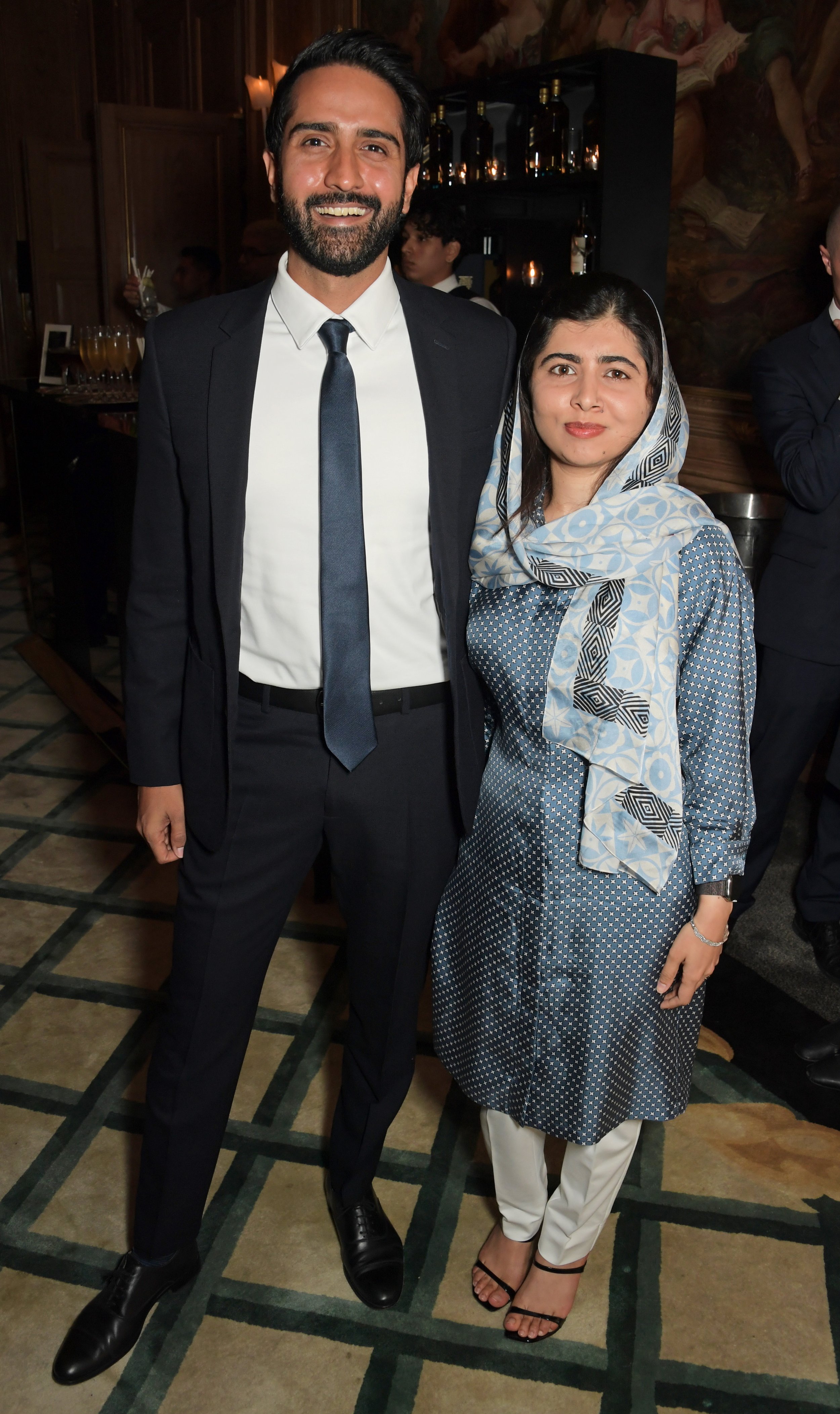  LONDON, ENGLAND - SEPTEMBER 04: Asser Malik and Malala Yousafzai attend a celebration of Edward Enninful's new memoir "A Visible Man" at Claridge's Hotel on September 4, 2022 in London, England. (Photo by David M. Benett/Dave Benett/Getty Images) 