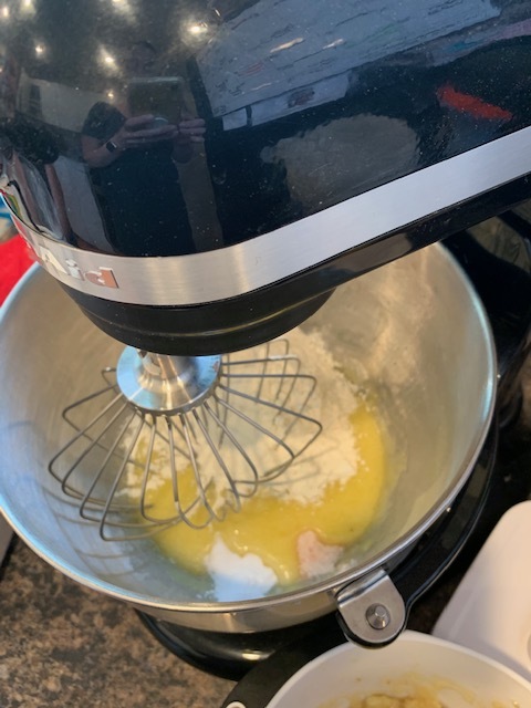 Add the baking powder, salt, and half the flour. Mix, add half the mashed bananas, then the rest of the flour, mix, then the rest of the bananas and mix. The recipe says to sift the dry ingredients. I don’t think we’ve ever sifted them and it’s always turned out great.