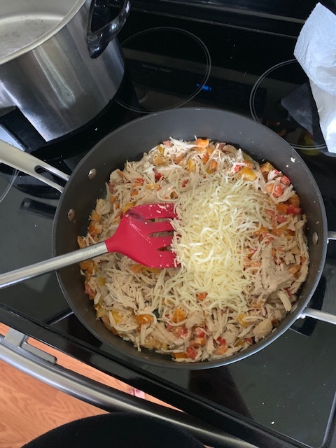 Once the chicken, peppers, and cream are mixed, add your cheese. I’ve used colby jack, pepper jack, cheddar, but mozzarella is my favorite for this recipe.