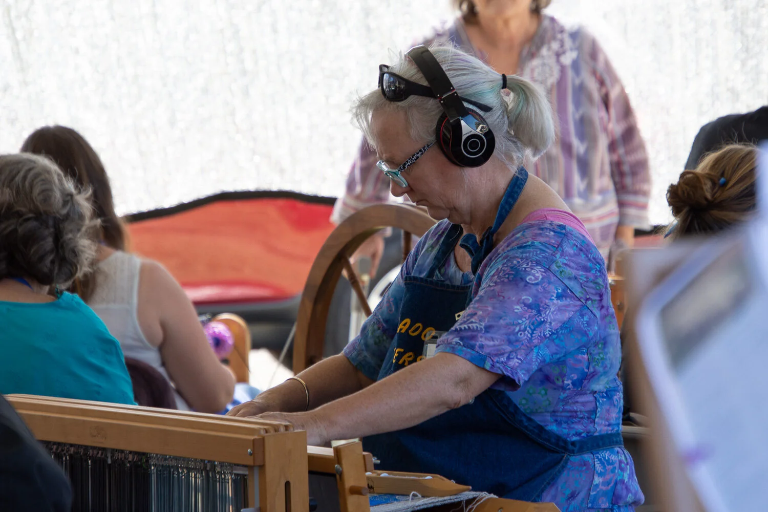 Serious weaver during sheep to shawl contest