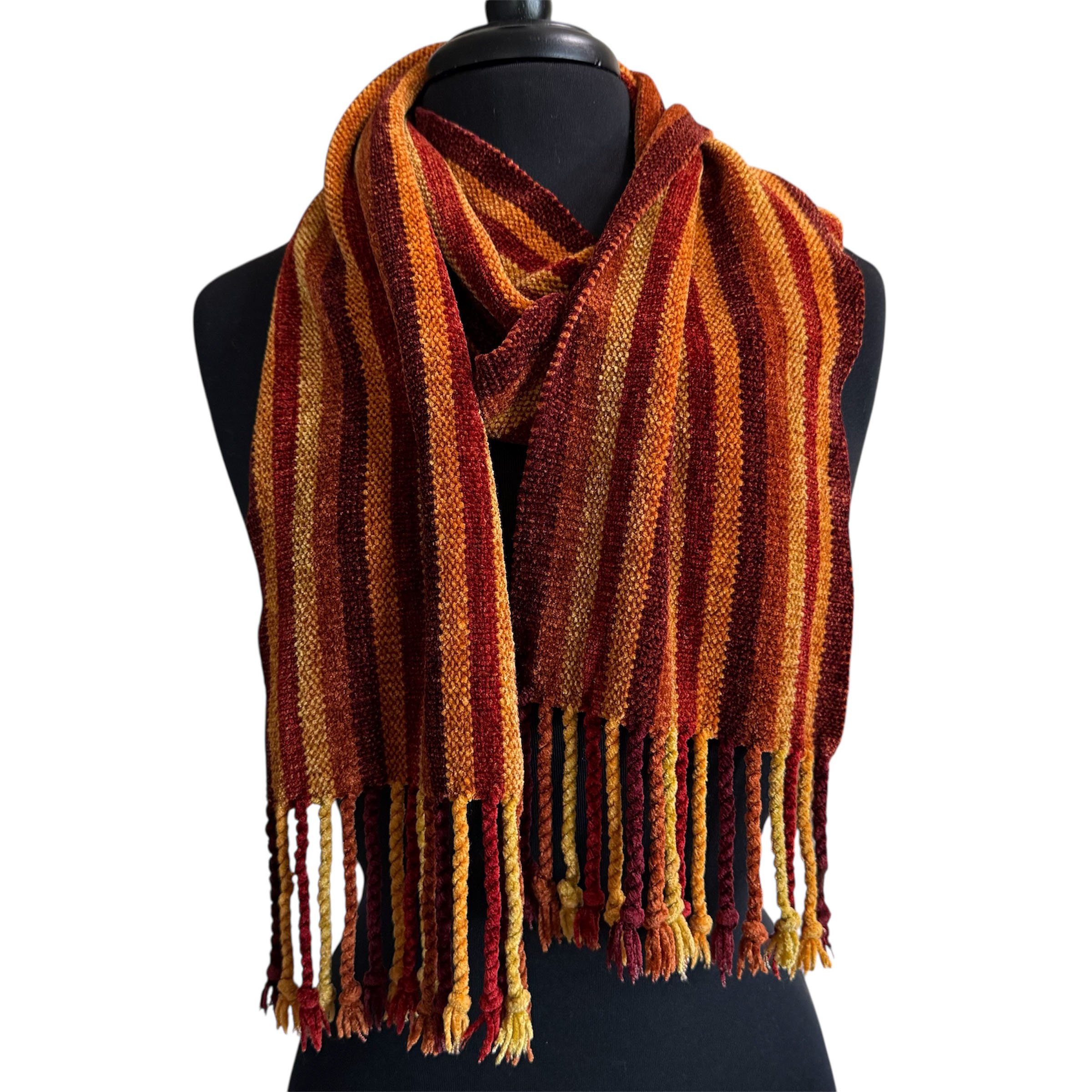 Chenille scarf in fall colors on black mannequin.