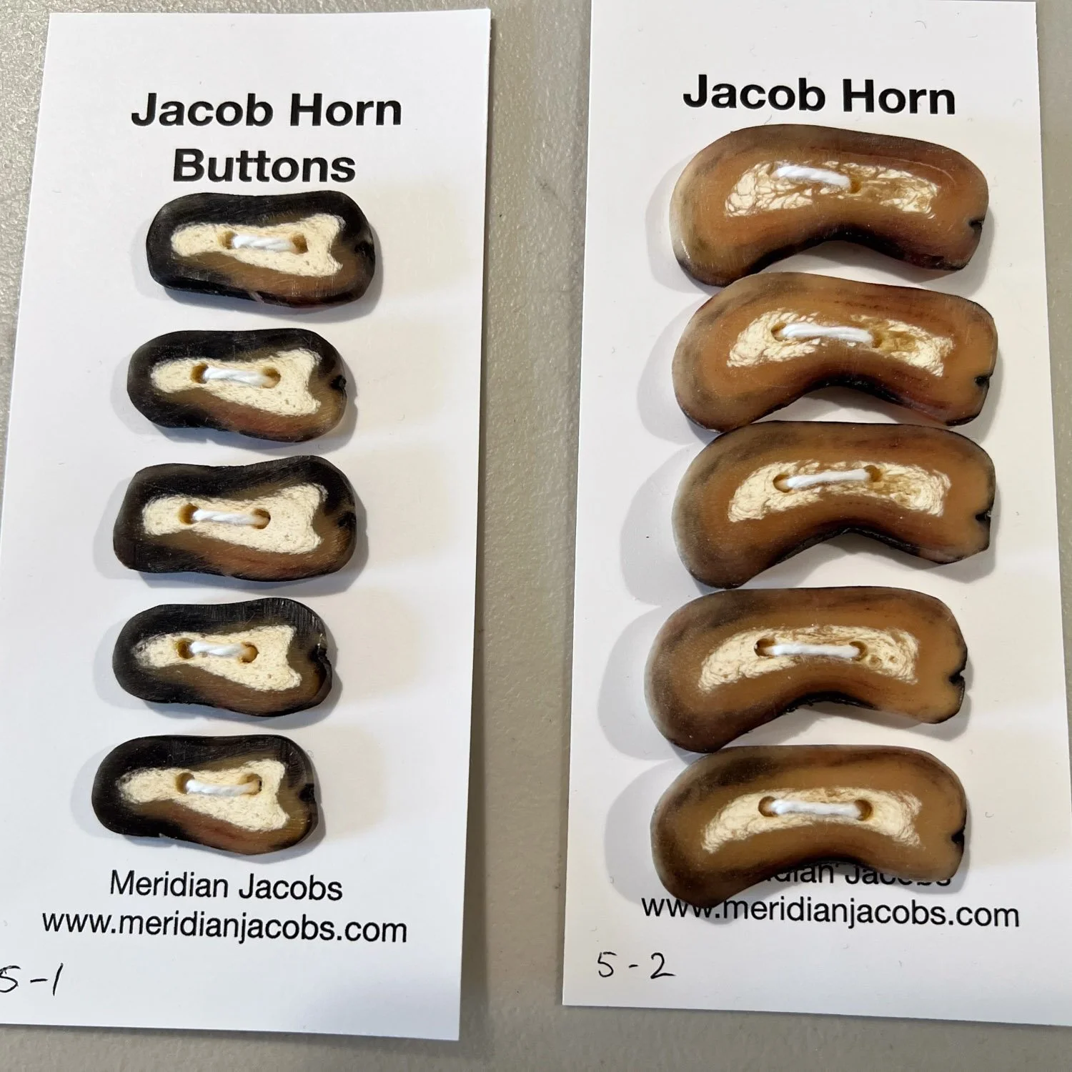 Jacob horn buttons on cards in two sets of five.