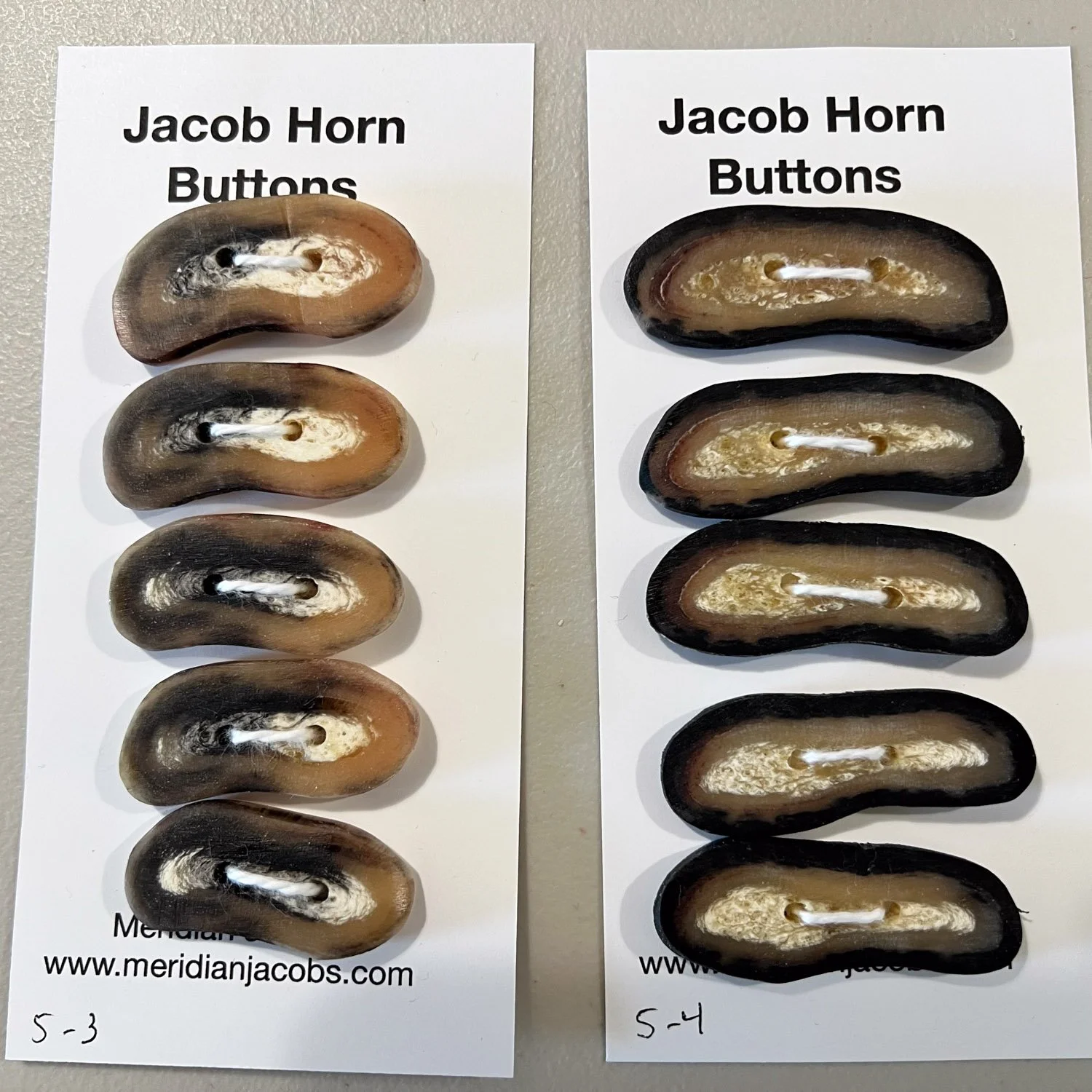 Jacob horn buttons on cards in two sets of five.