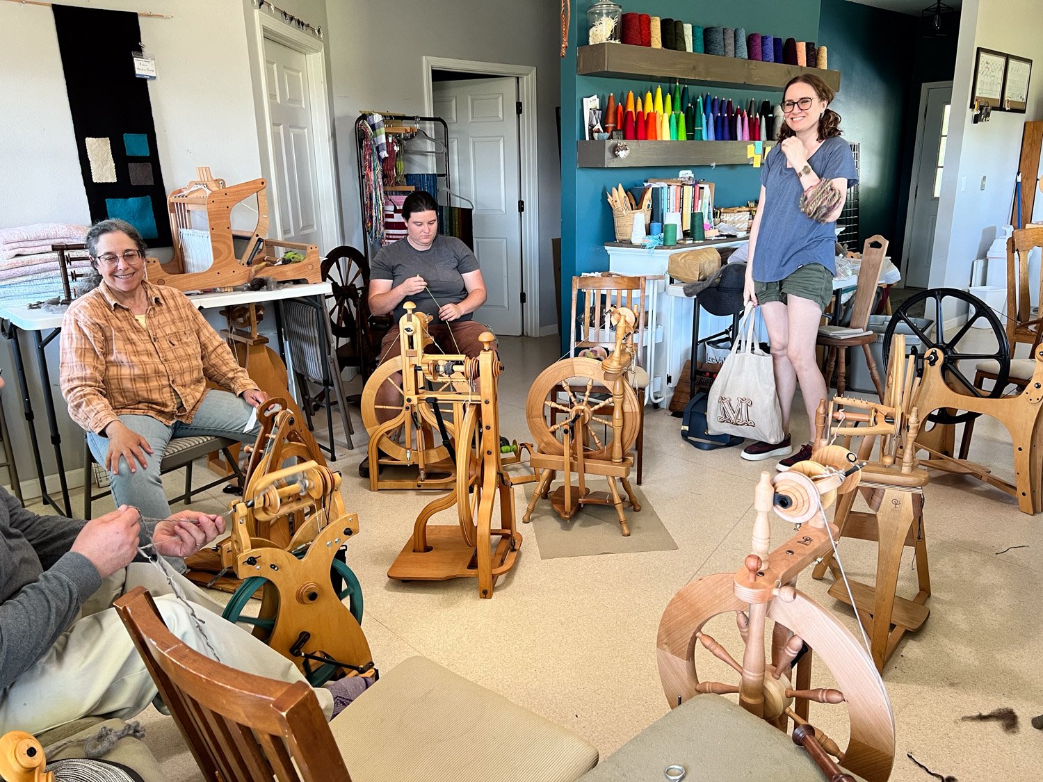 Group of people spinning on spinning wheels.