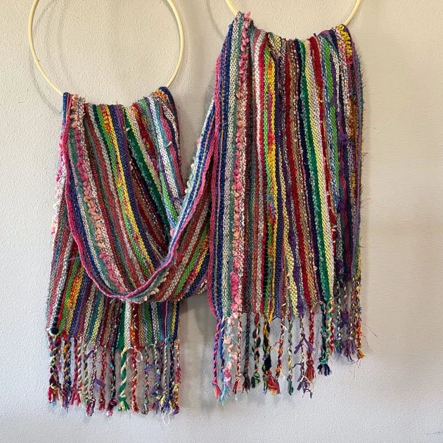 Colorful scarf hanging on rings.