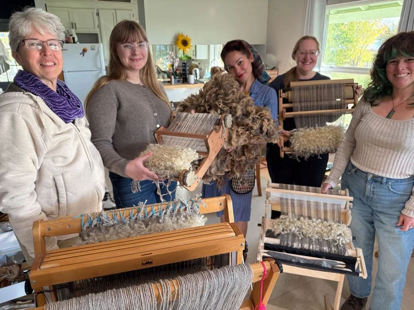 Students with Varafeldur projects in progress on looms.