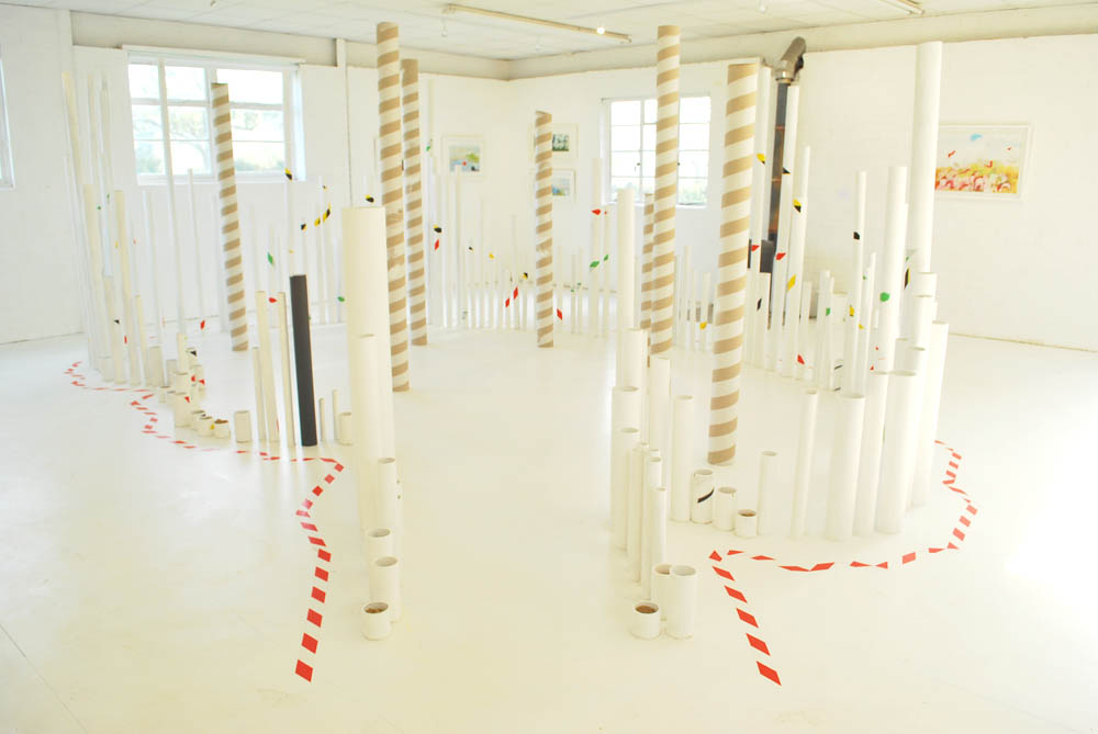  Using all seven parts of the brain, Installation, 2016  weighted cardboard tubes, warning tape, white paint  Unit One, Sweffling, Suffolk 