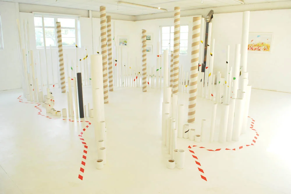 Using all seven parts of the brain, Installation, 2016 weighted cardboard tubes, warning tape, white paint Unit One, Sweffling, Suffolk