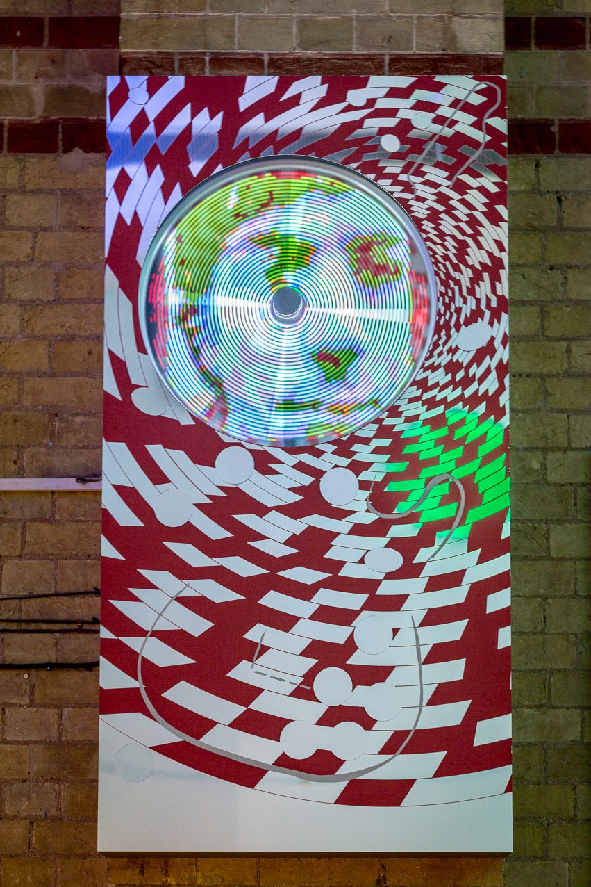  CODA, 2016 aluminium casing housing spinning bicycle wheel  LED projection of animation based  Permanent art work for Cambridge Corn Exchange celebrating Syd Barrett founder of Pink Floyd. 