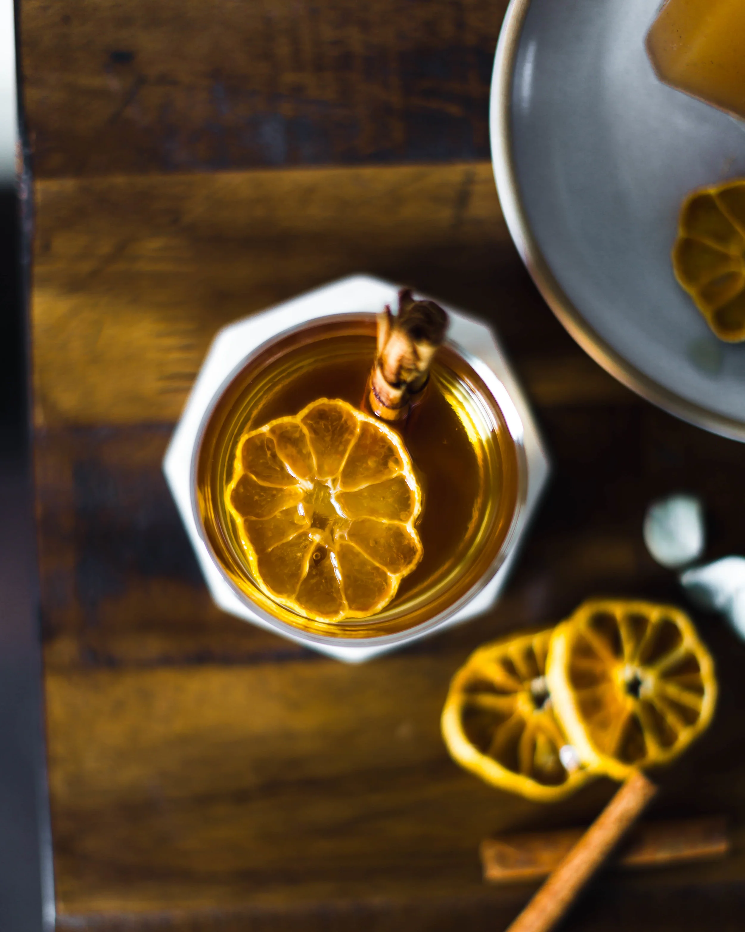 Spiced Citrus Shrub 4 cloves, crushed 2 star anise, crush 1 teaspoon black peppercorns, crushed 1 cinnamon stick, crushed 3 cups of large oranges srubbed and rough chopped. 1 1/2 cups cane sugar 1 vanilla bean, seeded 1/4 cup to 1/2 cup coconut vinegar In a skillet, toast the spices until fragrant. Add in a large bowl the toasted spices, oranges, sugar and vanilla. Combine really well, cover and place aside for up to a day on the countertop. Add in coconut vinegar, 1/4 cup at a time. Taste and see if it is to your liking. Cover and let it sit for up to a day on the counter. Strain into a container and store in the fridge. To serve add to some sparkling water or club soda—adjust to your liking and enjoy! Spiced Old Fashioned 2oz rye whiskey 1/2oz shrub syrup .25oz water 2 dashes Angostura bitters 1 dash orange bitters Maraschino cherry In a cocktail shaker with ice, combine all ingredients except the maraschino cherry. Shake until cold, strain into a glass and garnish with cherry.