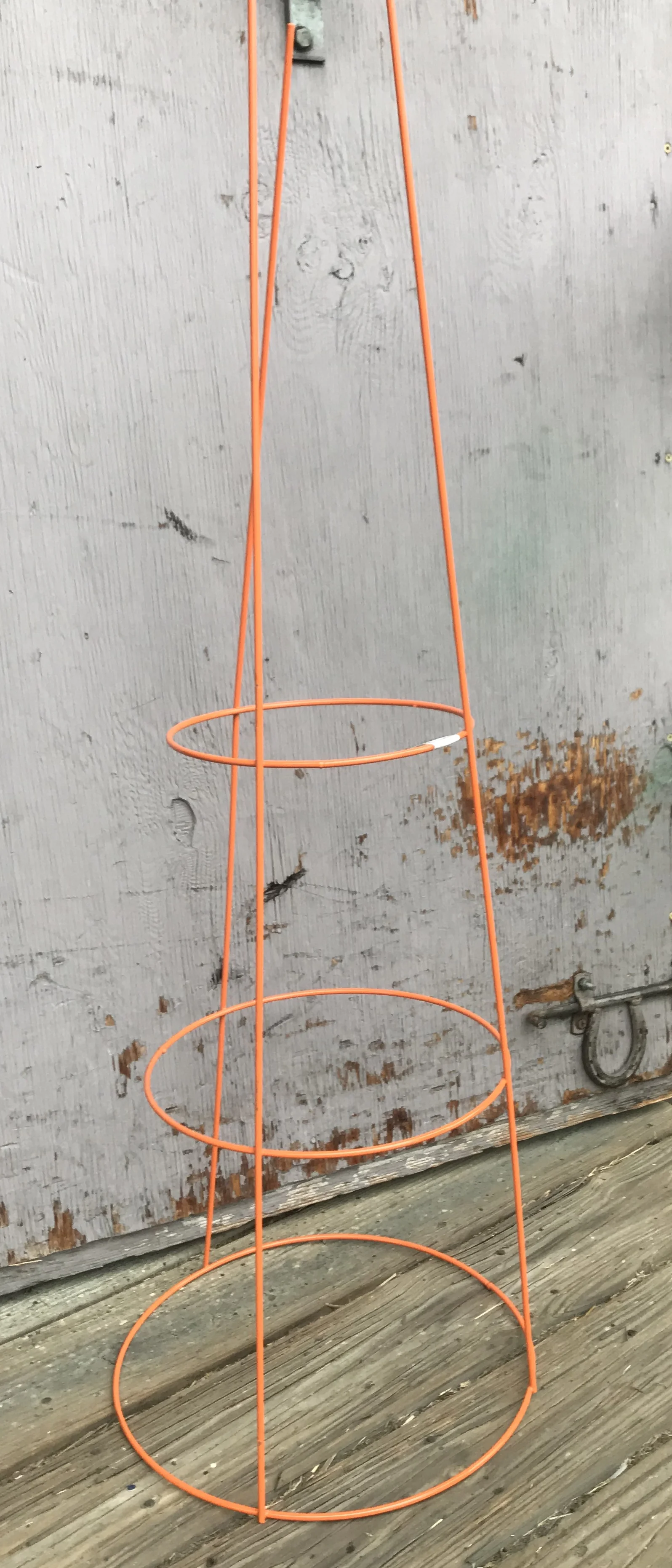 We have a variety of plant props, including tomato cages of varying sizes—some collapsable for easy storage!
