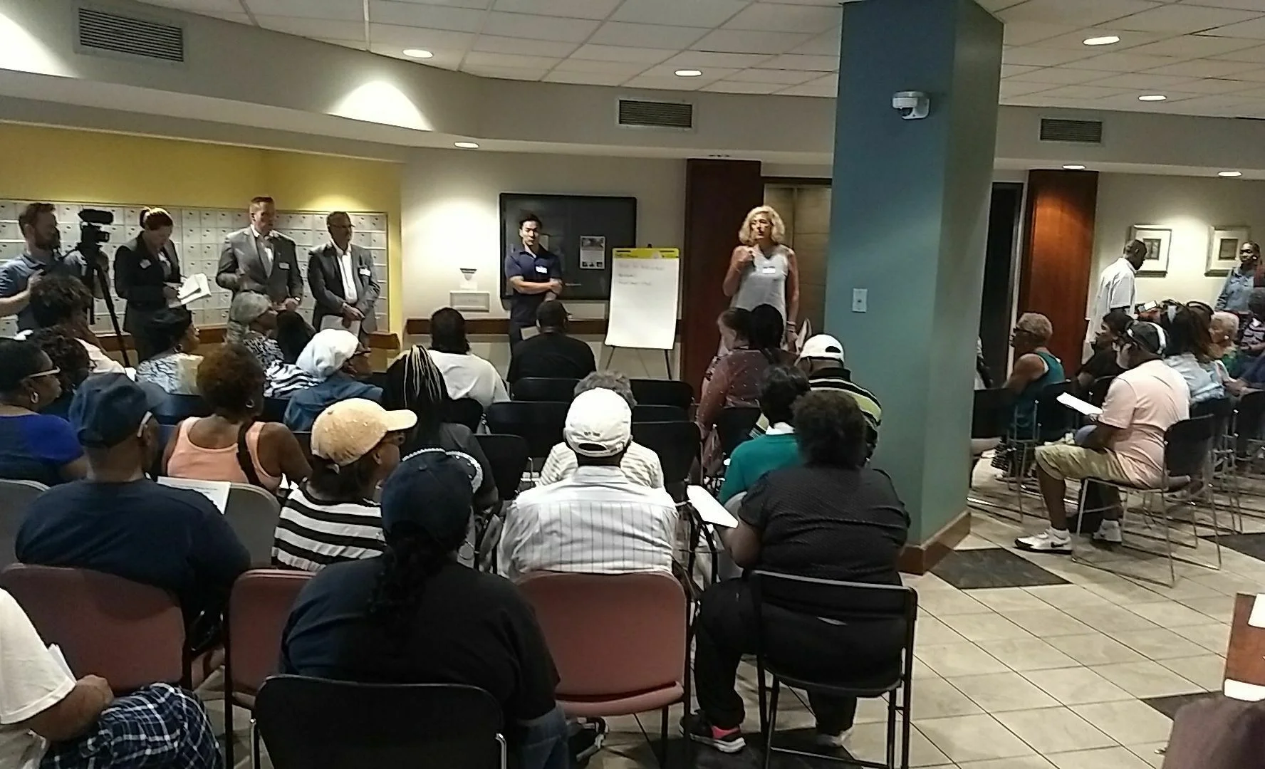 July 10, 2019 - Vicki Davis and other executives from Urban Atlantic and Edgewood Management field questions from tenants and supporters regarding slum conditions at the Bolton House building in Baltimore. Photo Credit: PSL-Baltimore.