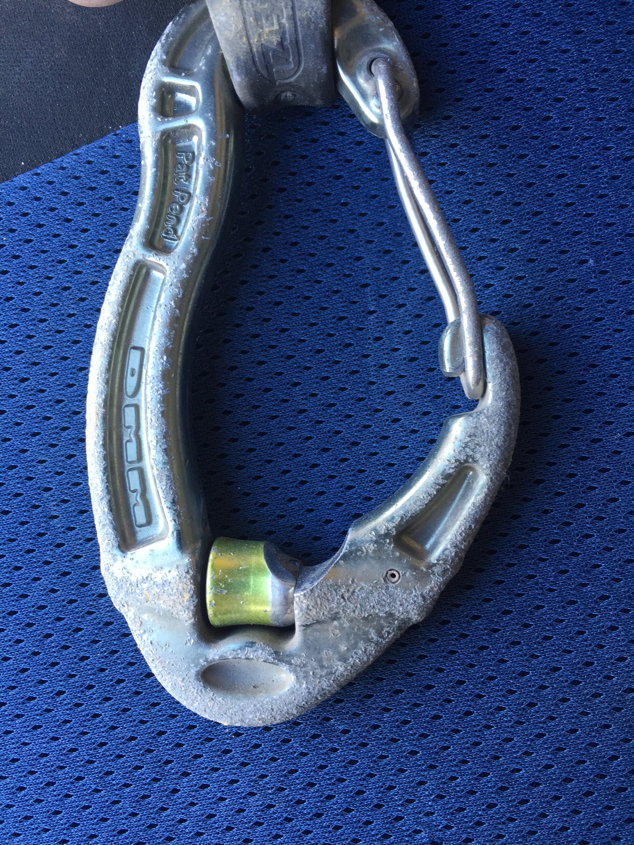 The roller stopped rolling and the rope cut this groove. Significantly more than 10% section loss. The quickdraw was at the beginning of a route, no one fell here so the wear is just when the draw was loaded during lowering. The edges were very sharp