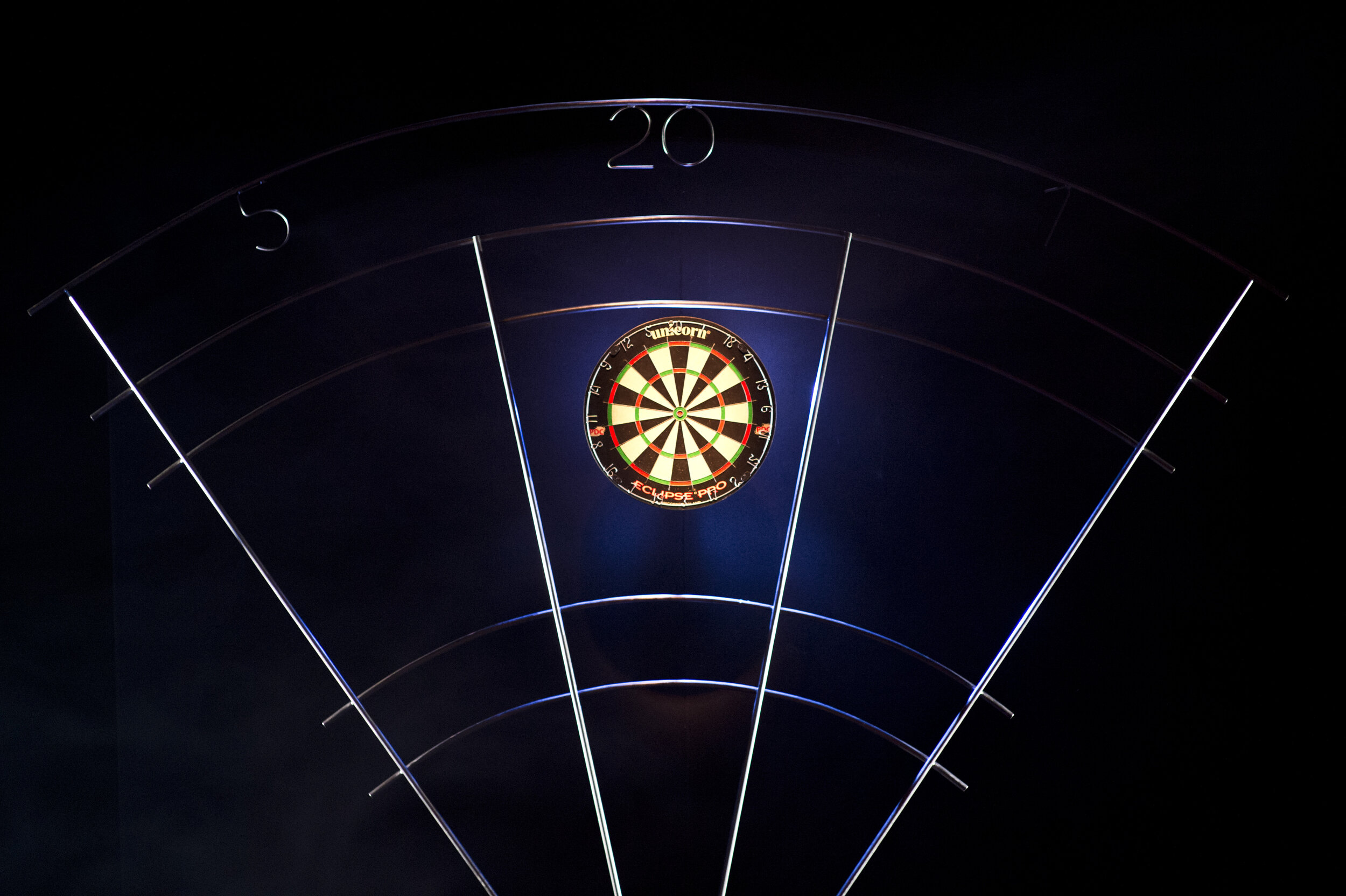  A dartboard centre frame with the set surrounding it. 
