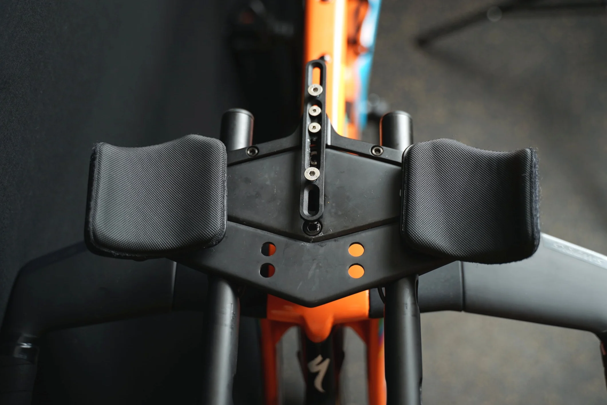 The water bottle cage holder can mount to either the front or the back of the wing, and then it has a sliding adjust-ability from there to position the bottle either closer or farther from you. Can also be used for a computer mount instead of a bottle cage.