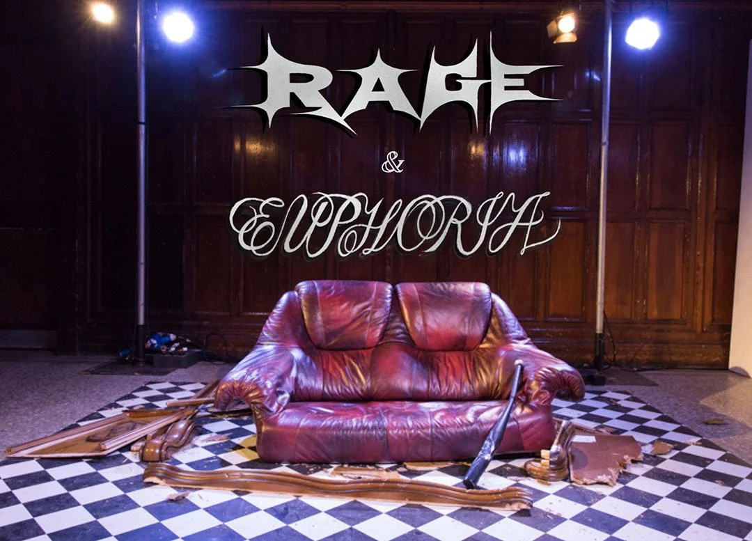 A half destroyed leather sofa on a checkered floor. The text "rage & euphoria" is superimposed in artistic font.