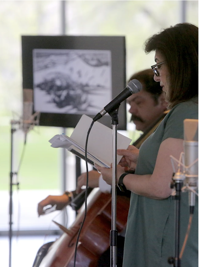 Dunya Mikhail and Karim Wafi poetry and cello performance.png