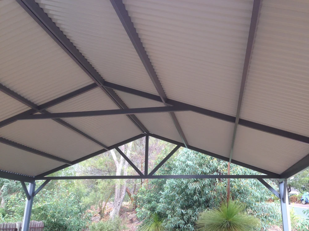 Clear polycarbonate patio roof on a steel frame