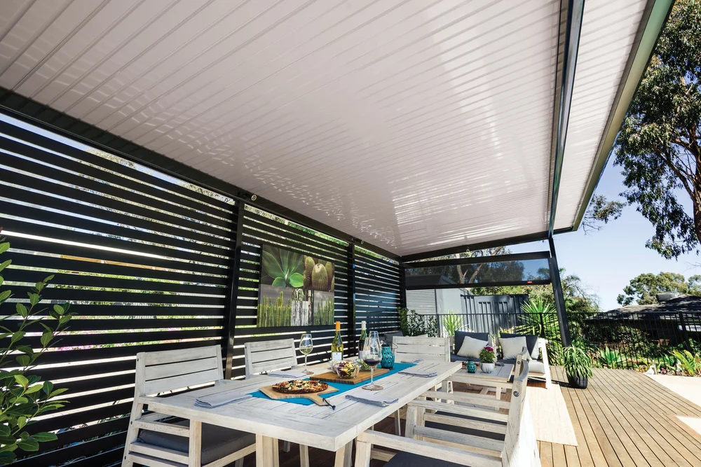 White flat roof patio over an outdoor dining setting