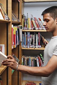 Teenager taking book.jpg