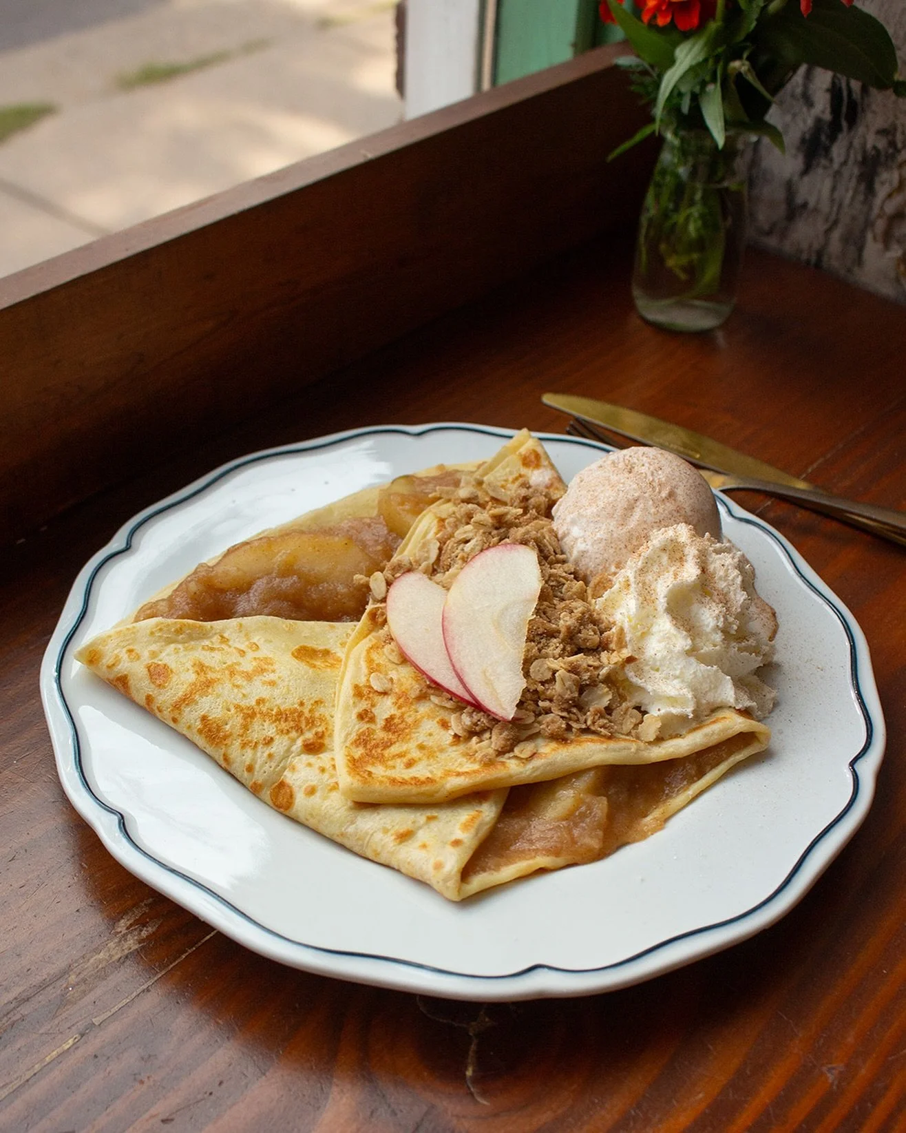 Apple Crisp Crepe - rich cinnamon-y apple pie filling topped with buttery oatmeal crumble, candied pecans. @fairwaycreamery cinnamon ice cream, and fresh whip!