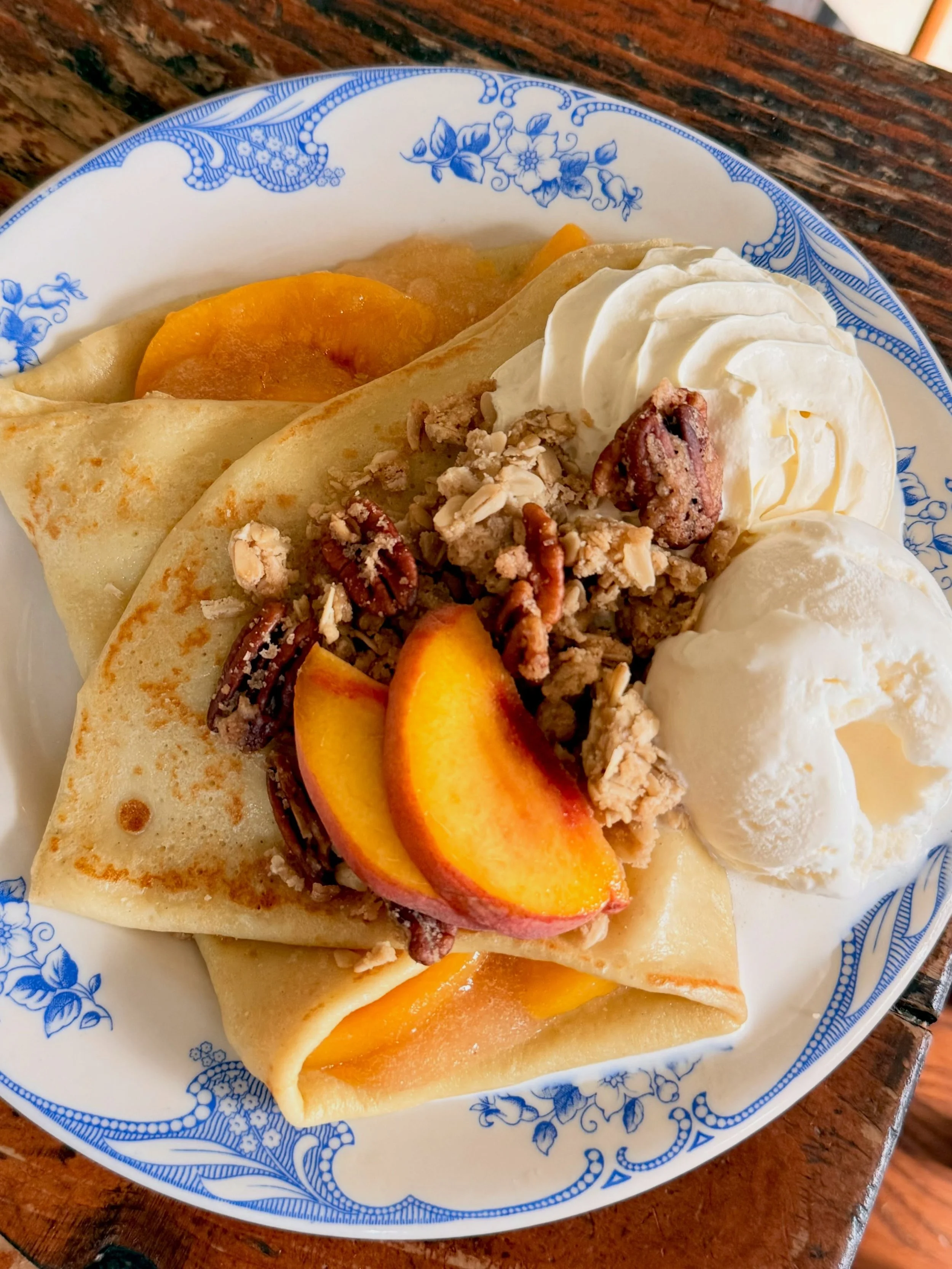 It's peach season! Our bourbon soaked peach compote is everything late summer. Fresh whipped cream, house made oat crisp and candied pecans and of course a scoop of @fairwaycreamery madagascar vanilla ice cream.