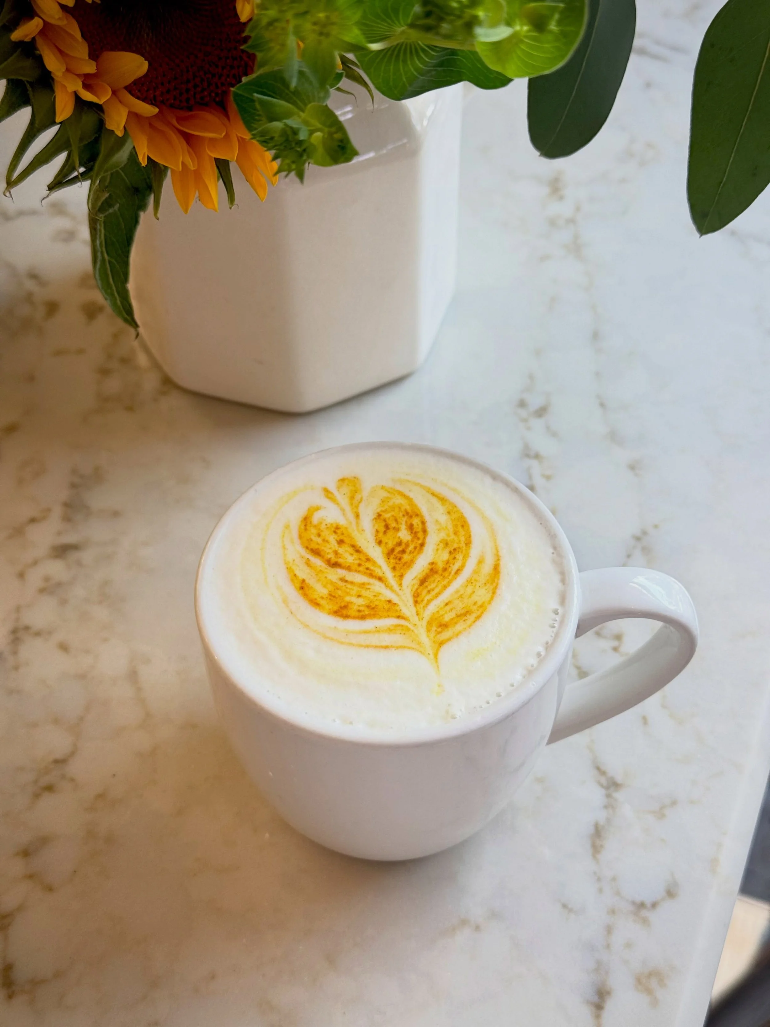 Golden Milk Latte - tumeric, ginger, licorice root and lemongrass sweetened with pure maple syrup and vanilla. 
Caffeine free, full of cozy fall warmth. Hot or iced!