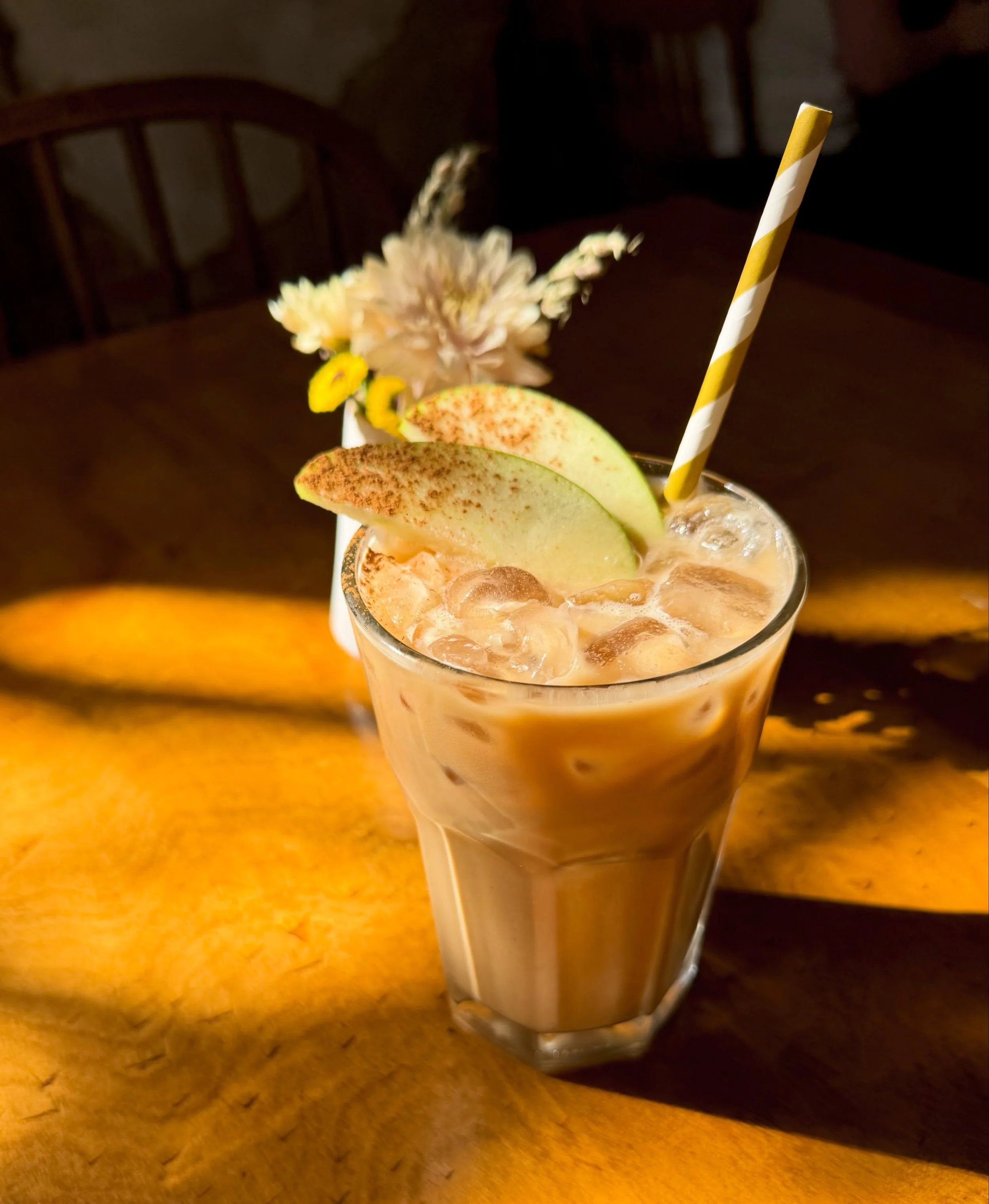 How about an iced caramel apple latte?? Or hot. That's cool too. House made browned butter caramel is blended with our crisp green apple syrup. She's delish.