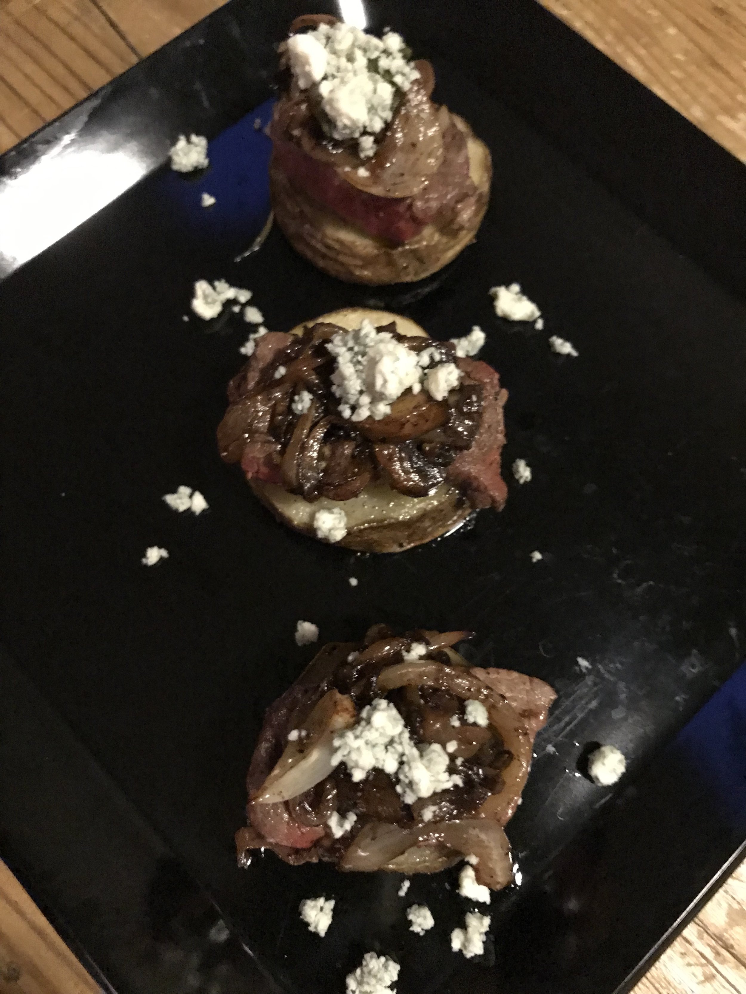  Filet Bites on Quartered Russet potatoes with onions, mushrooms and crumbled Blue Cheese. 