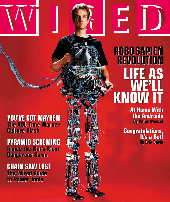 Dan Paluska standing with the M2, a two-legged humanoid robot he developed at MIT.