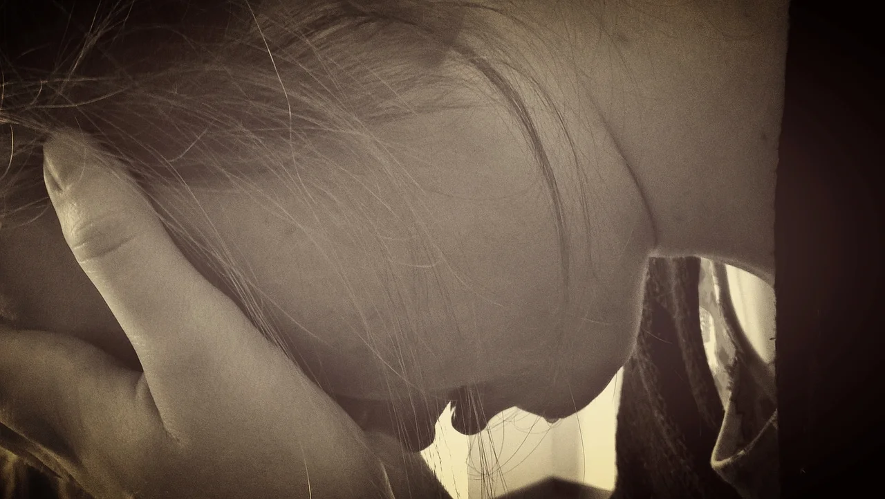 woman crying head in hands.jpg