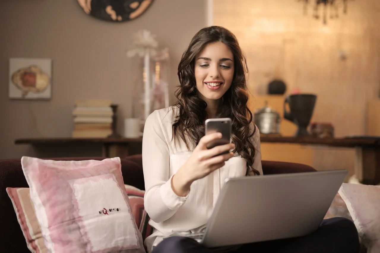 woman online laptop phone.jpeg