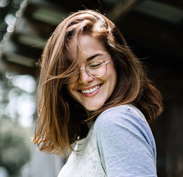 girl looking down smiling.jpg