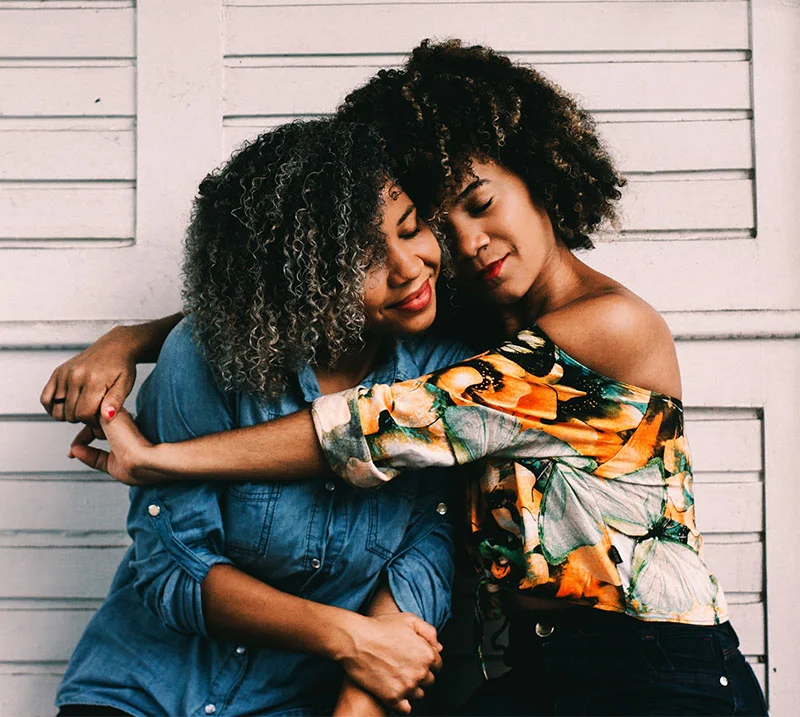 girlfriends hugging on bench.jpg