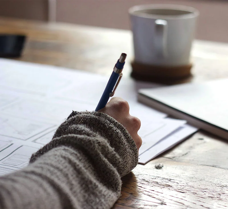 woman writing notebook coffee.jpg